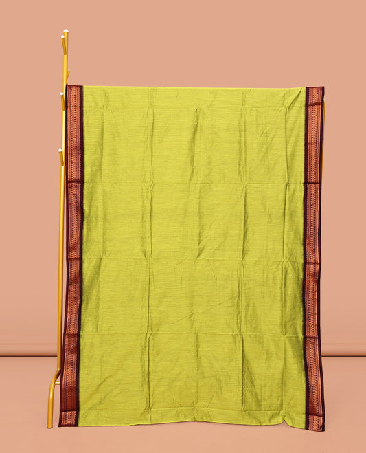 Green Plain Kalyani Cotton Saree, Complemented by a Contrast Traditional Zari Design Border, Pallu Features Traditional Zari Designs, and Paired with a Contrast Blouse