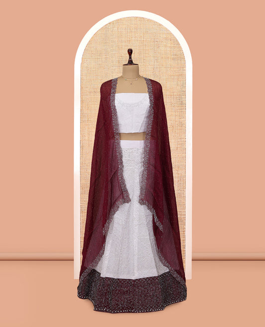 Off-white Banarasi Half-Saree, Finely Crafted with Bead Work Skirt, a Contrast Stone Work Border, Matching Blouse, and Contrast Scallop Stone Work Dupatta