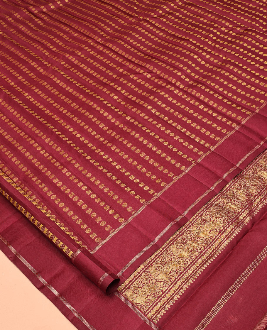Light Maroon Kanchipuram Designer Silk Saree, Steeped in Richness of Mayil-Chakram Buttas, a Subtle Bodi Border, Butta-Enclosed Checked Pallu, and a Matching Blouse