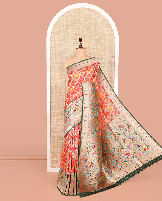 Orange Dola Silk Saree, Beautifully Bedecked with Bandhani Ghar Chola Patterns on Its Body, Complemented by Contrast Muniya Paithani Floral-Peacock Border, Pallu of Muniya Paithani Floral-Peacock Design, and Paired with a Contrast Blouse