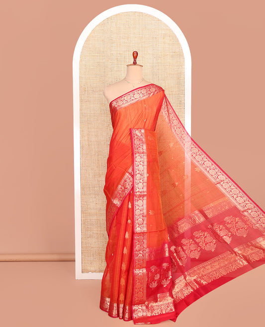 Orange Silk Cotton Saree, Ornamented with Zari Buttas All Over Its Body, Complemented by a Contrast Floral Creeper Zari Design Border, Pallu of Floral Zari Designs, and Paired with a Contrast Blouse