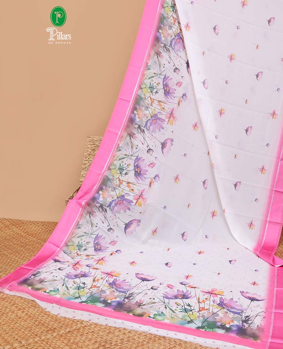 White digital floral design moss chiffon saree with contrast pink zari border & floral design pallu