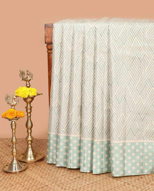 Green geometrical print, zari butta fancy tussar saree with polka dot border & polka dot pallu along with polka dot blouse