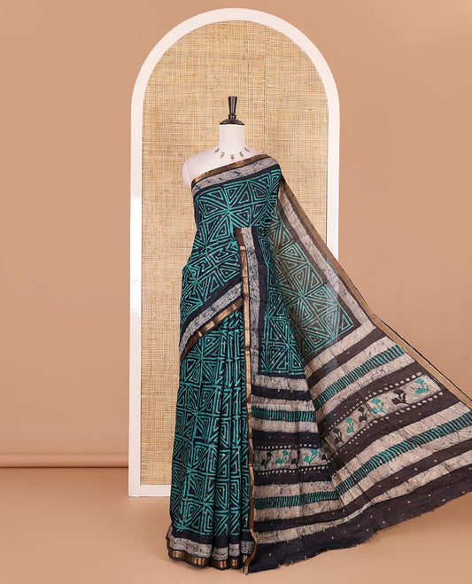 Navy blue and green batik printed with zari buttas woven chanderi cotton saree, zari piping border, batik block printed pallu, and zari buttas matching blouse