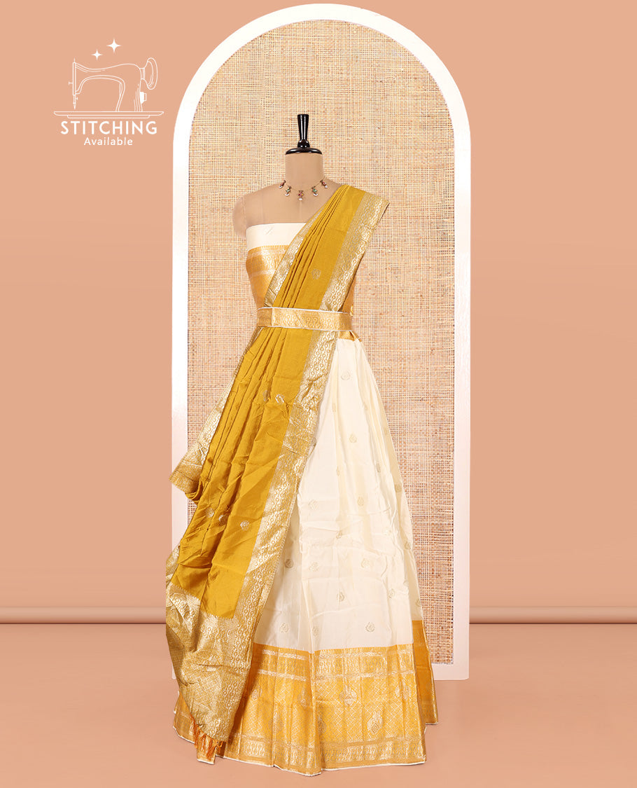 Cream-Yellow Semi-Banarasi Half-Saree Set Featuring Buttas Skirt, Contrast Traditional Border, Matching Blouse, and Banaras Dhavani