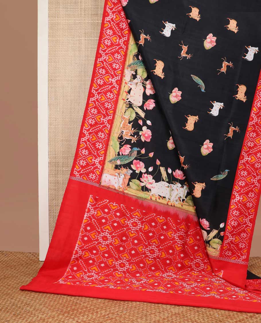 Black pichwai style design printed silk saree with contrast floral design & ikkat style floral design pallu