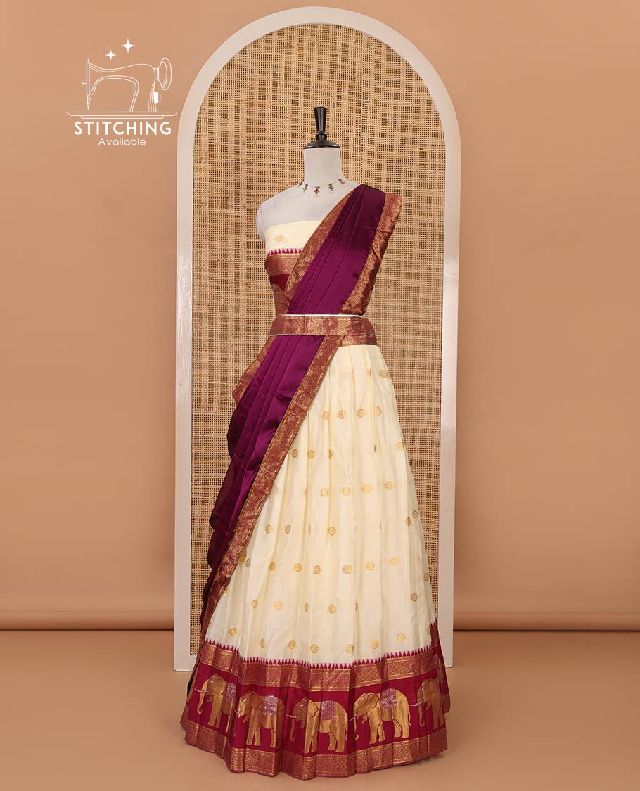 Cream semi-banaras half-saree, buttas & contrast traditional zari elephant border skirt, zari blouse & contrast-wine zari border georgette dhavani