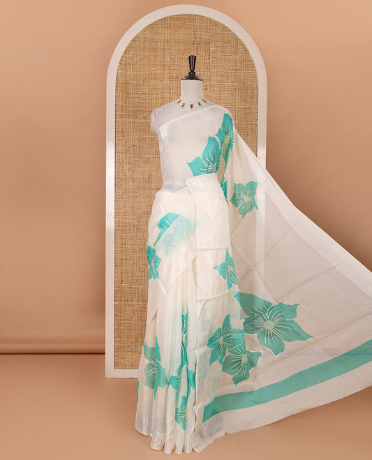 Cream floral placement-style printed Marble chiffon saree, zari border & contrast rama green gotta patti work & mixed embroidered blouse