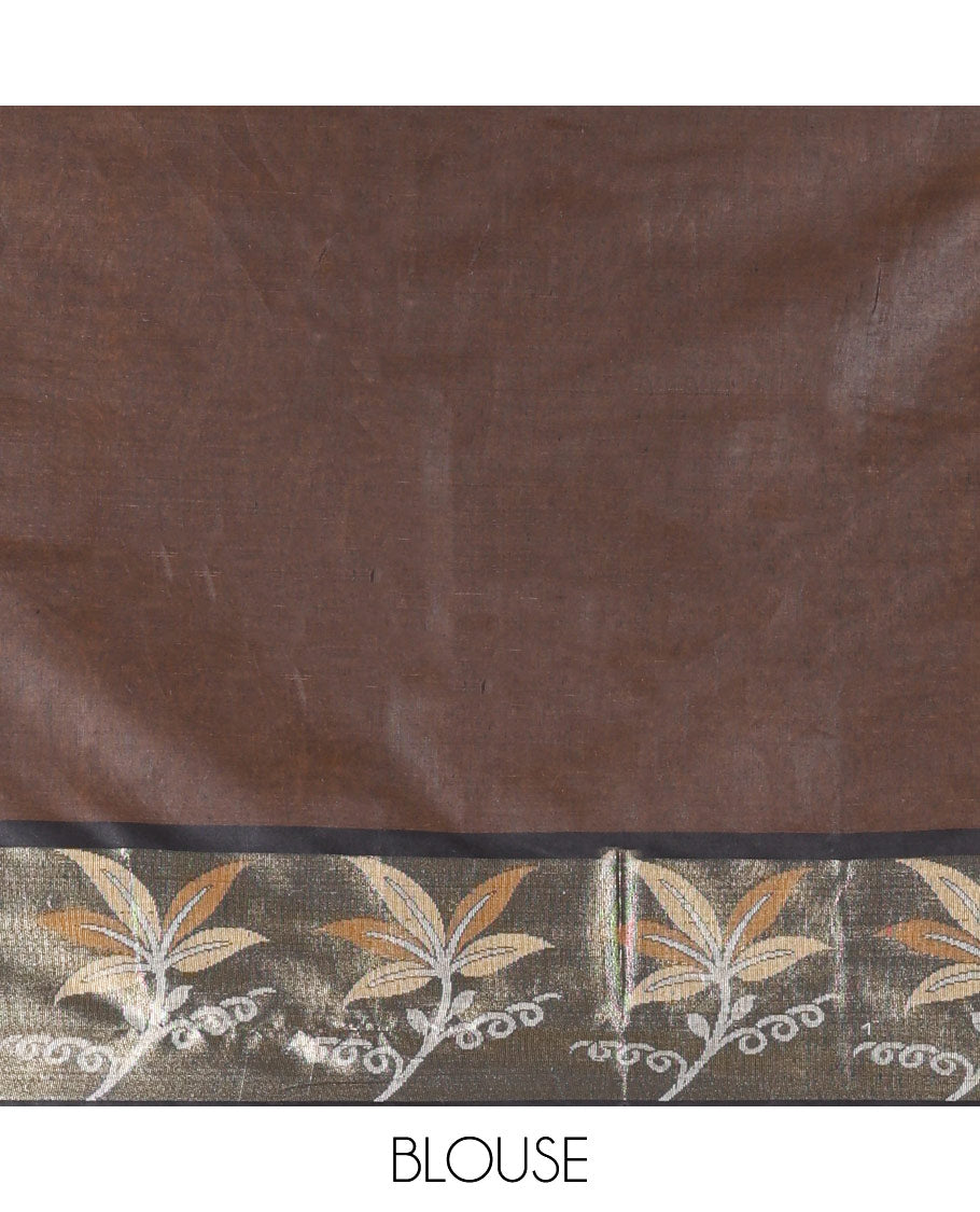 Brown Chanderi Cotton Saree, Prettified with Leaf Motifs on Its Body, Complemented by a Contrast Border of Leaf Designs, Pallu Steeped with Colorful Floral Designs, and Paired with a Contrast Blouse