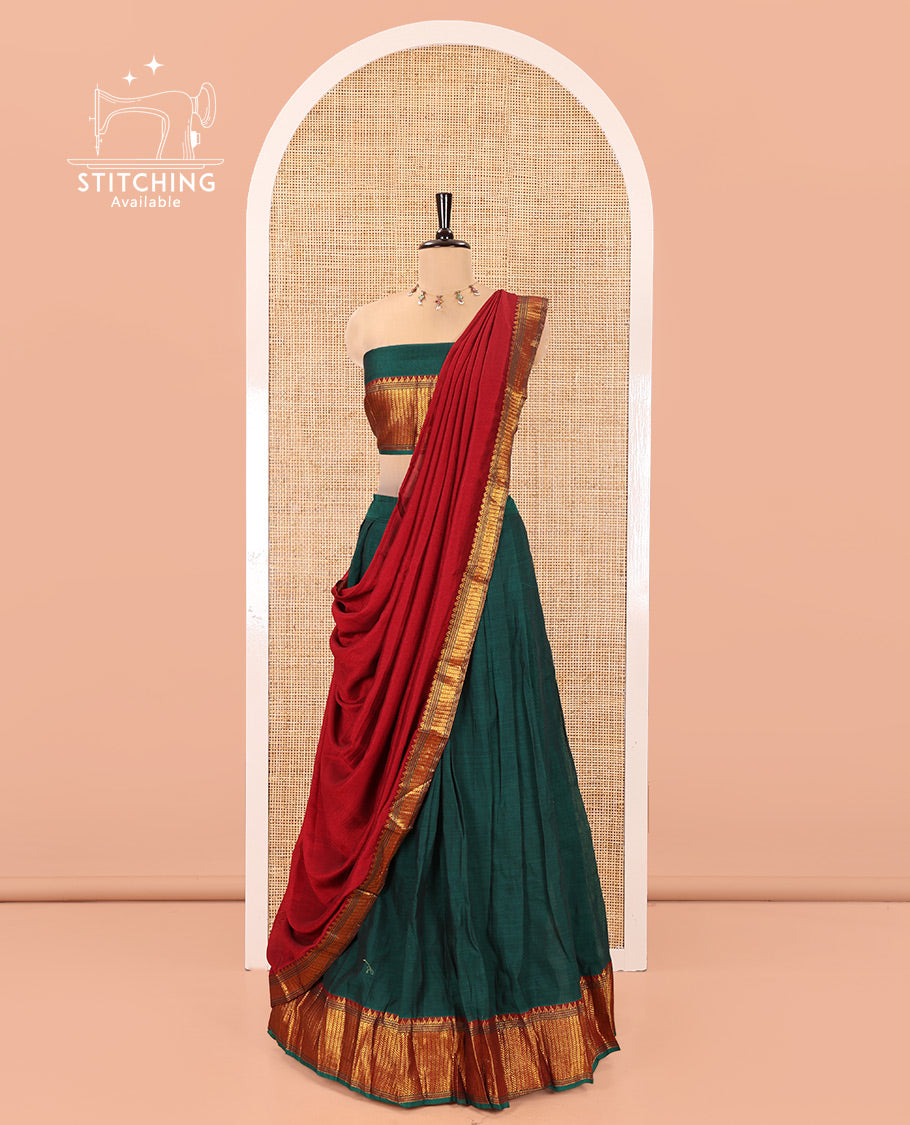 Bottle Green Mercerised Cotton Half-Saree Features Plain with Contrast Traditional Zari Temple Bordered Skirt, Paired with a Matching Blouse, and Comes with a Contrast Zari-Bordered Dhavani