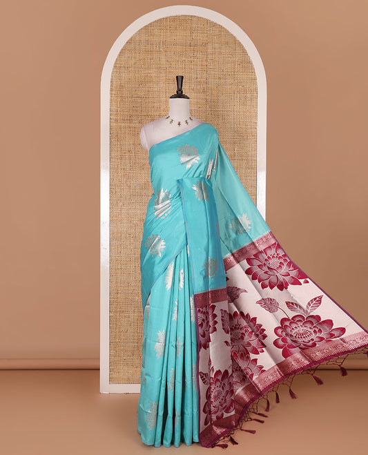 Borderless green floral motifs steeped elite soft silk saree, contrast lotus-like motifs pallu, and contrast buttas blouse