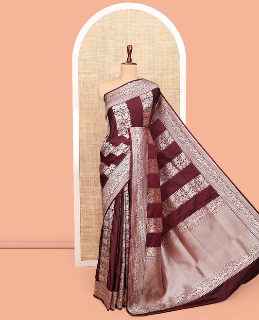 Maroon Semi-Banaras Silk Saree, Impeccably Detailed with Animal-themed Jacquard Designs on Its Body, Highlighted by a Zari Border of Traditional Designs, Pallu Steeped with Stripes, and Paired with a Matching Blouse