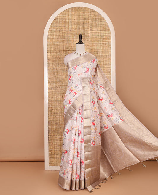 Light peach floral motifs printed fancy tussar saree, ogee patterned zari border,  plain pallu, and plain matching blouse