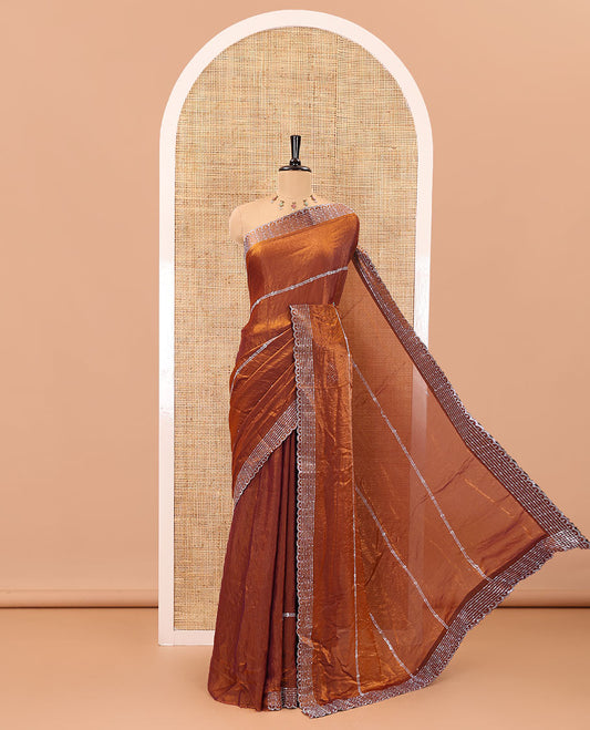 Honey color horizontally swarovski stone striped fendi chiffon saree, swarovski stone work border, and a plain blouse