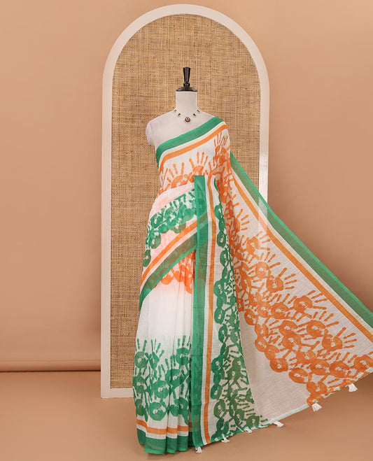 White-base batik National flag-theme printed linen saree features tri-color handprints, contrast border & green plain blouse