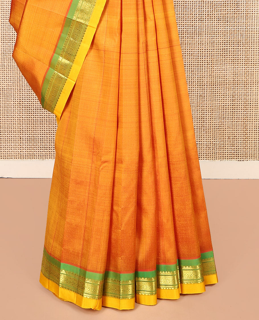 Orange Kanchipuram Silk Saree, Woven with Zari Buttas, Complemented by a Contrast One-Sided Border of Rekku and Jaal Designs, Zari Design Pallu, and No Blouse