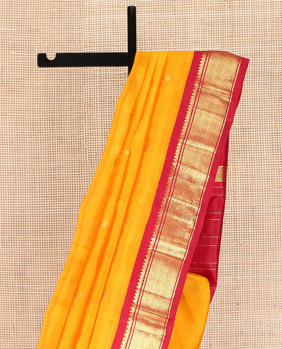 Yellow Kanchipuram Silk Saree, Sparsely Woven with Zari Buttas on Its Body, Complemented by Contrast One-Sided Korvai Border of Thilakam Mokku, Banaras, and Jaal Designs, Pallu Features Zari Designs, and Comes Without a Blouse