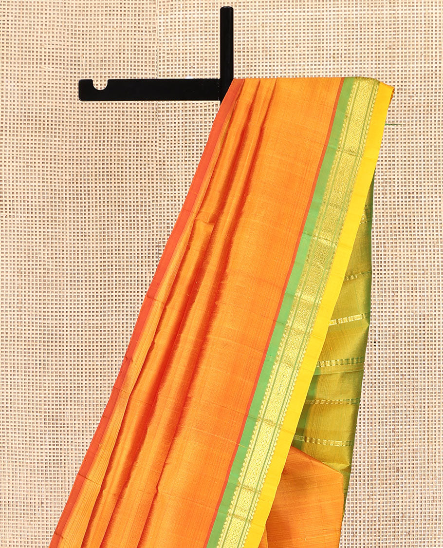 Orange Kanchipuram Silk Saree, Woven with Zari Buttas, Complemented by a Contrast One-Sided Border of Rekku and Jaal Designs, Zari Design Pallu, and No Blouse