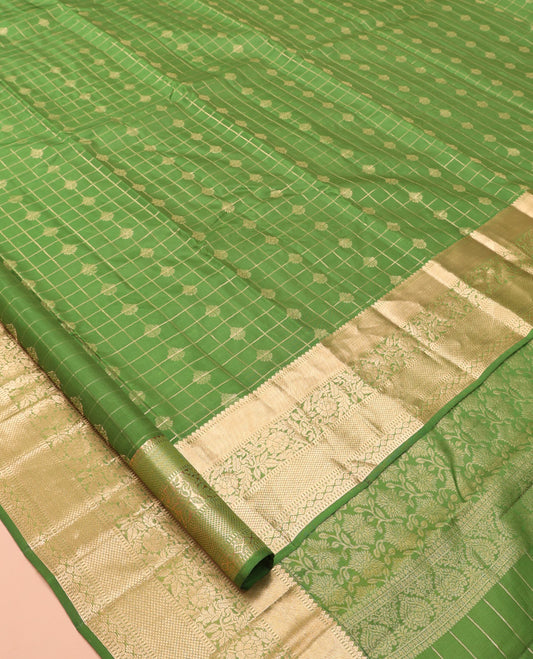 Green Vasundhara Lite Silk Mix Saree, Ornamented with Zari Buttas and Checks, a Zari Border of Thilakam, Kodi Visiry, and Kuyil Kann Designs, Grand Pallu, and a Matching Blouse