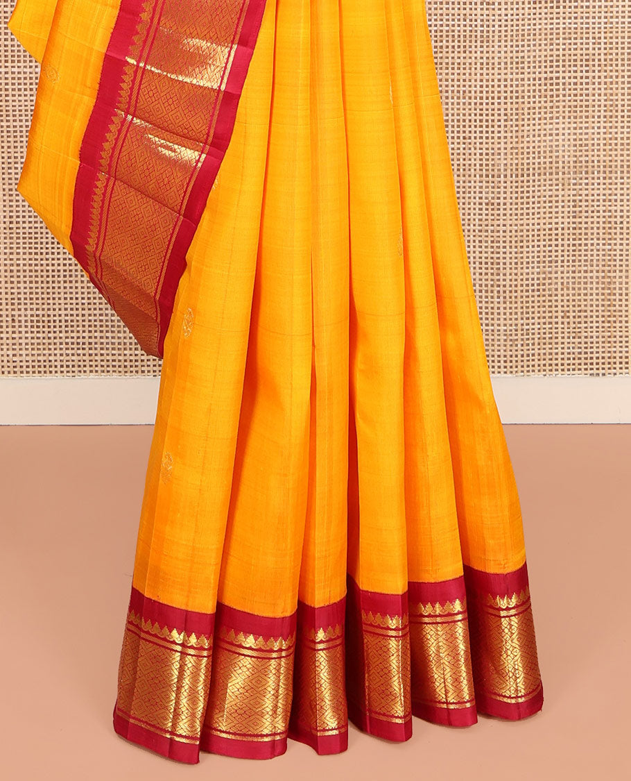 Yellow Kanchipuram Silk Saree, Sparsely Woven with Zari Buttas on Its Body, Complemented by Contrast One-Sided Korvai Border of Thilakam Mokku, Banaras, and Jaal Designs, Pallu Features Zari Designs, and Comes Without a Blouse