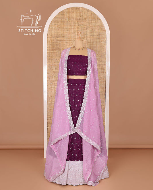 Purple half-saree, floral motifs embroidered semi-raw silk top, matching embroidered blouse, and contrast scallop embroidered georgette dhavani