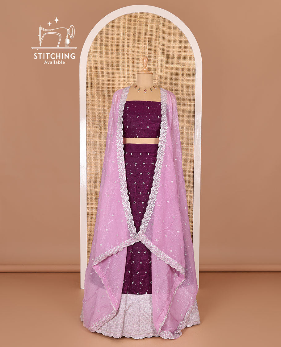 Purple half-saree, floral motifs embroidered semi-raw silk top, matching embroidered blouse, and contrast scallop embroidered georgette dhavani