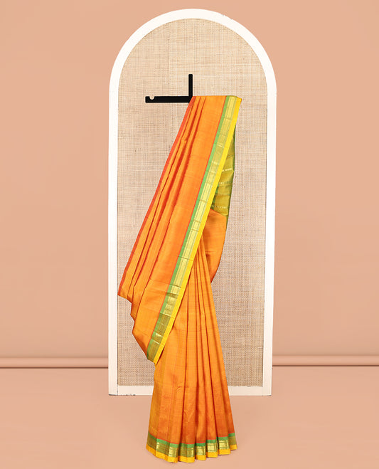 Orange Kanchipuram Silk Saree, Woven with Zari Buttas, Complemented by a Contrast One-Sided Border of Rekku and Jaal Designs, Zari Design Pallu, and No Blouse