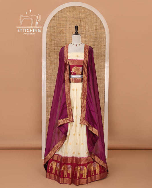 Cream semi-banaras half-saree, buttas & contrast traditional zari elephant border skirt, zari blouse & contrast-wine zari border georgette dhavani