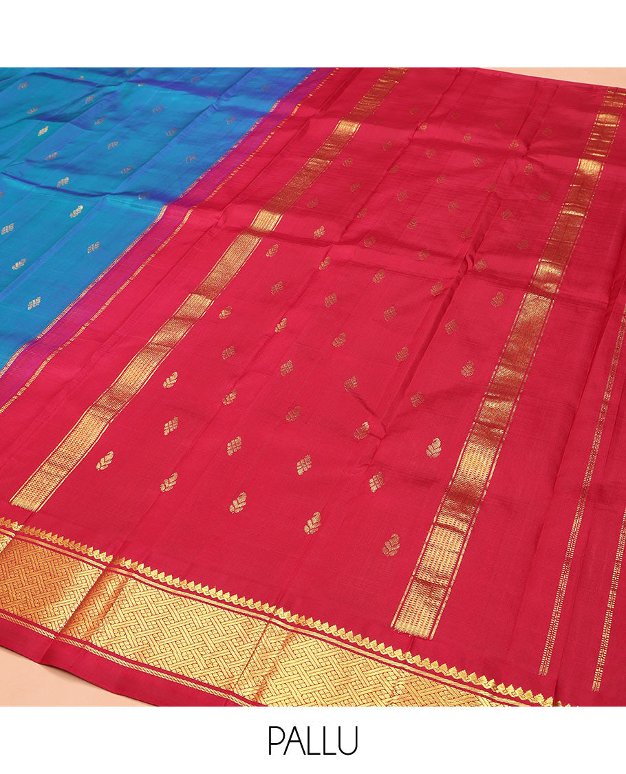 Blue Kanchipuram Silk Saree, Beautifully Bedecked with Zari Buttas, Complemented by Contrast One-Sided Border of Thazampoo Rekku, Thilakam Mokku, and Jaal Designs, Pallu of Zari Designs, and Comes Without a Blouse