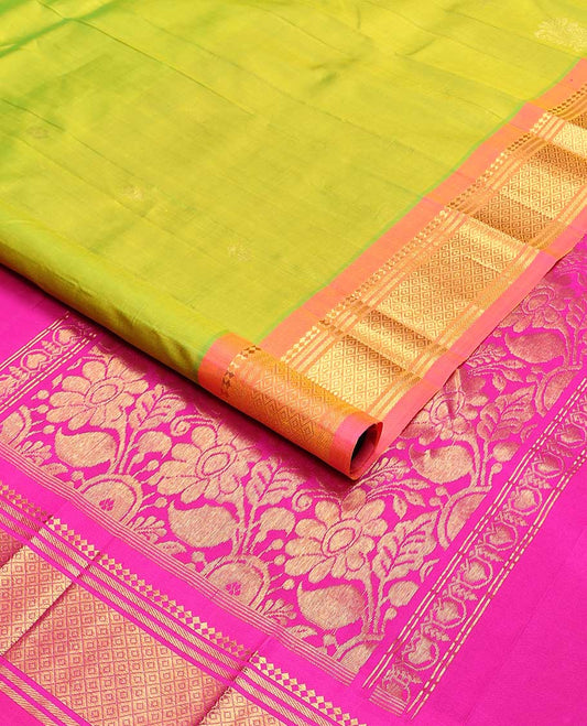 Light green buttas kancheepuram silk saree with contrast border of thilakam moku, banaras, kuyil kann design & zari design pallu