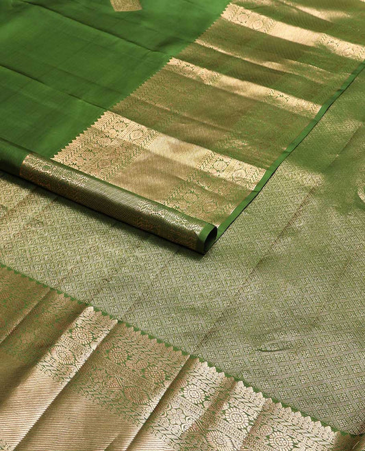 Green geometric buttas kancheepuram silk saree with self border of rekku, poo chakram, mayil banaras design & zari design pallu