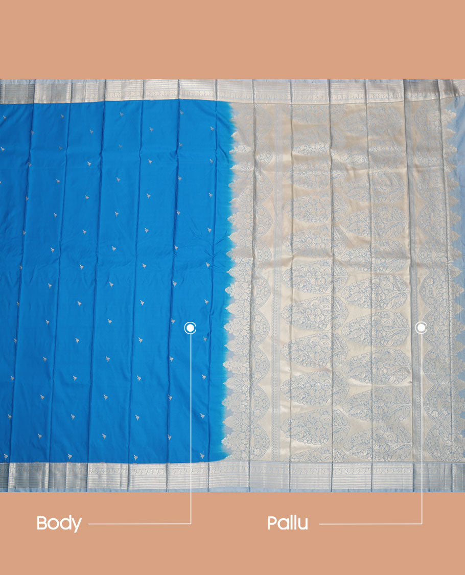 Blue Budget Silk Saree, Embellished with Zari Buttas All Over Its Body, Complemented by a Contrast Traditional Zari Design Border, Mughal-Style Floral Designs Pallu, and Paired with a Contrast Blouse