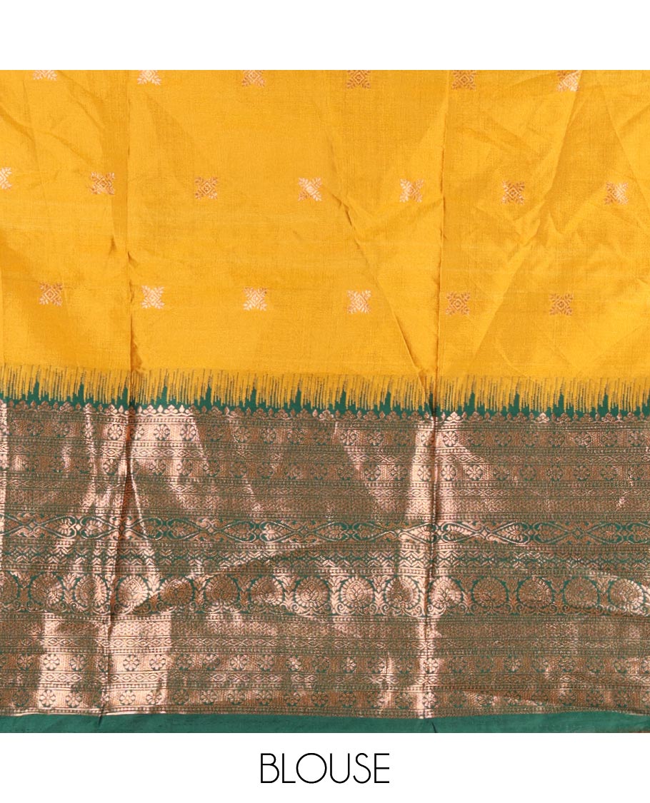 Mustard taffeta silk half saree, zari buttas with contrast green traditional zari border skirt, matching zari design blouse, and contrast plain zari border syska georgette dhavani