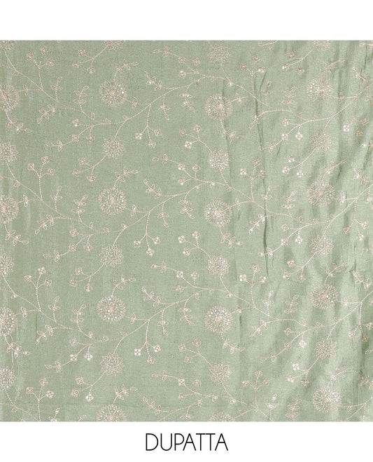 Dark green Vichitra silk material churidar set, floral motifs embroidered top, contrast Santoon bottom, and floral vine thread embroidered scallop dupatta