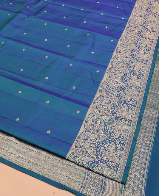 Blue Vasundhara Silk Saree, Accentuated with Zari Buttas All Over Its Body, Highlighted by a Zari Border of Manga and Yaanai Designs, Grand Geometric Patterned Pallu, and Paired with a Matching Blouse