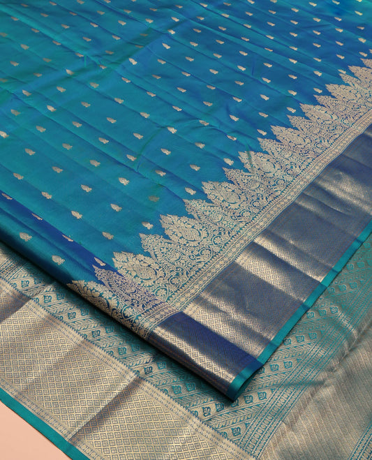 Blue Vasundhara Lite Silk Mix Saree, Ornamented With Zari Buttas All Over Its Body, Highlighted by Zari Border of Thilakam, Neli, Rudraksham, and Jaal Designs, Grand Pallu and Paired with a Matching Blouse