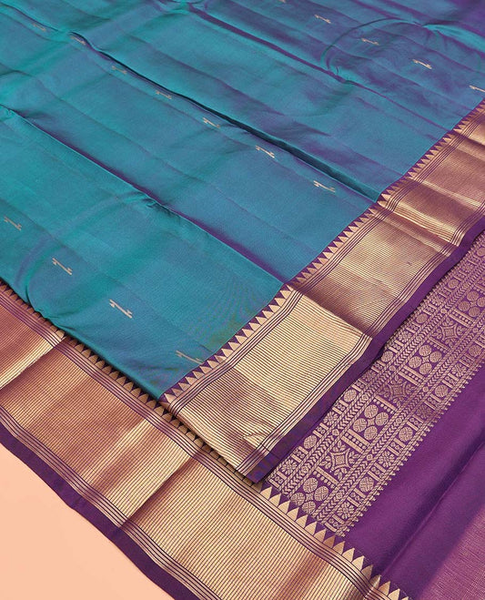 Blue Vasundhara Lite Silk Mix Saree, Sparsely Woven with Zari Buttas All Over Its Body, Complemented by a Contrast Temple Border, Grandly Decked Up Pallu, and Paired with a Contrast Blouse
