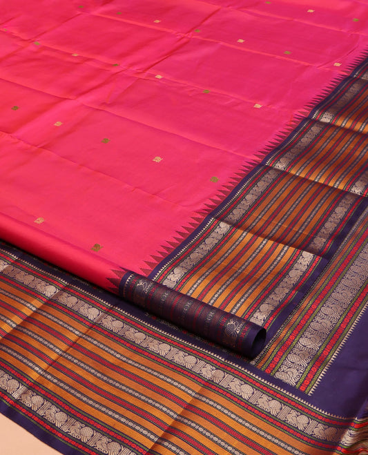 Pink Kanchipuram Silk Saree, Artfully Designed with Mayil Buttas on Its Body, Complemented by a Contrast Border of Rekku, Rudraksham, Mayil, and Kathir Designs, Pallu Steeped with Geometric Designs, and Paired with a Contrast Blouse