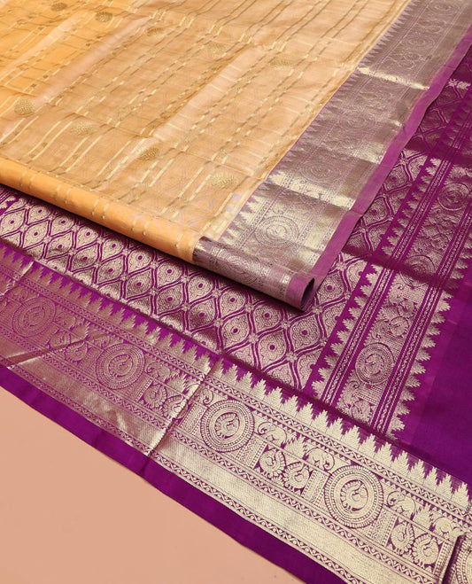 Sandal Venkatagiri Silk Saree, Masterfully Woven with Zari Buttas and Zari Stripes All Over Its Body, Complemented by a Contrast Temple Traditional Zari Border of Peacock and Elephant Designs, Grand Pallu of Jaal Designs, and Paired with a Contrast Blouse