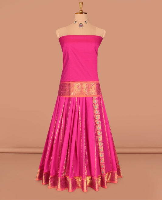 Pink Art Silk Pavadai Material Set, Enriched with Zari Designs on Its Skirt, Complemented by a Contrast Traditional Zari Border, and a Matching Blouse
