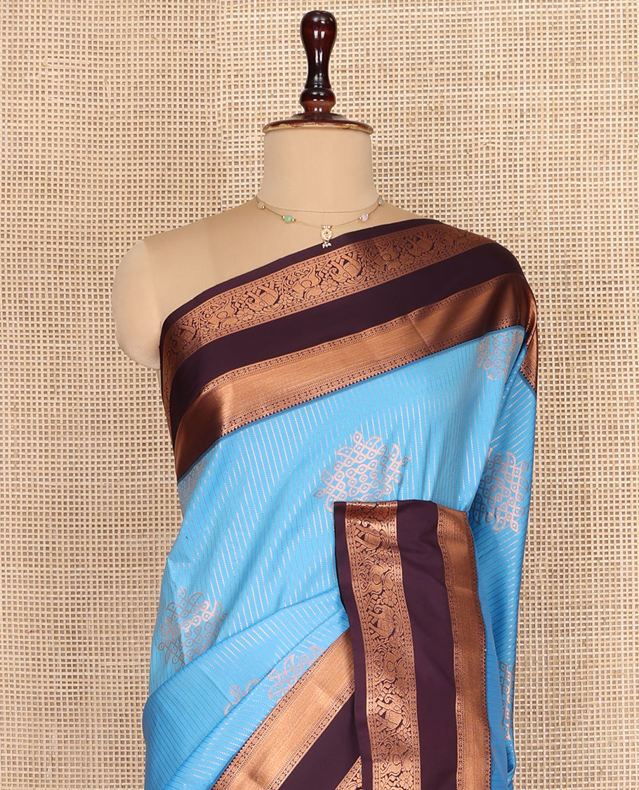 Blue Budget Silk Saree, Embellished with Zari Stripes and Kolam Buttas All Over Its Body, Complemented by a Contrast Traditional Zari Design Rettai Pettu Border, Grand Scallop Design Pallu, and Paired with a Contrast Blouse