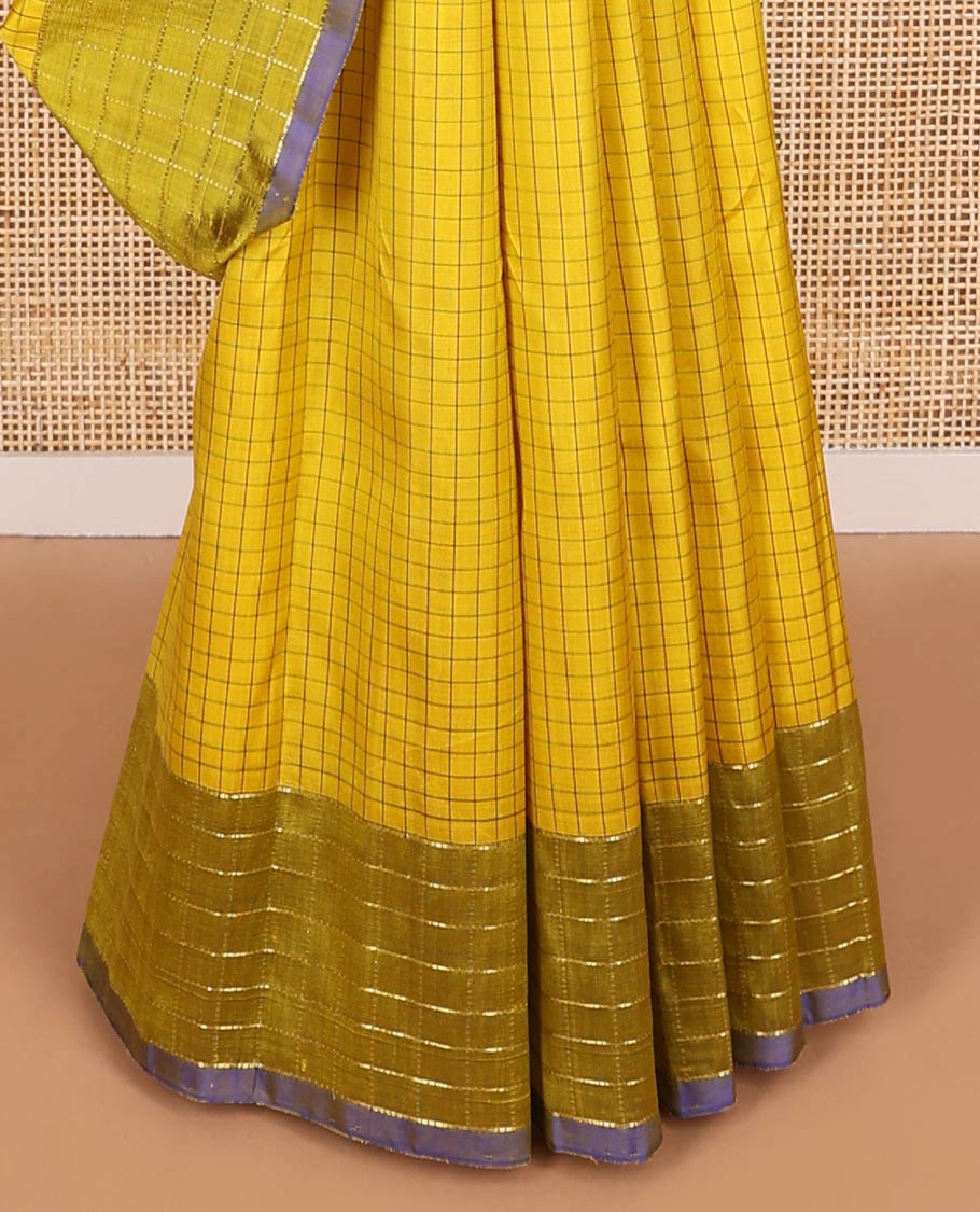 Light green checked kancheepuram silk saree with contrast checked border & floral design pallu
