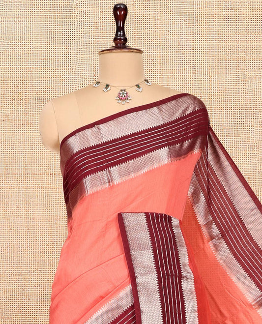 Peach Plain Assam Silk Saree, Complemented by a Contrast Traditional Zari Border, Zari-Striped Pallu, and a Contrast Blouse