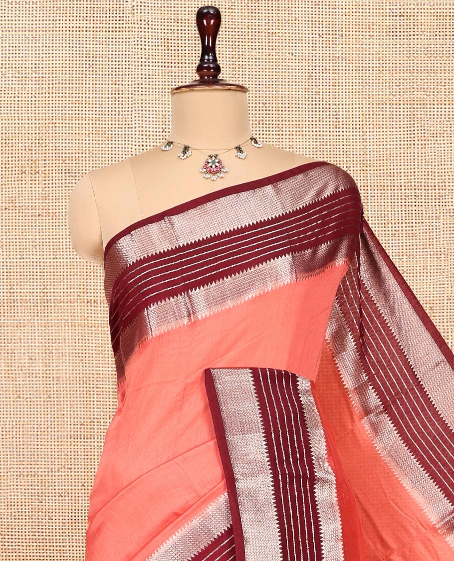 Peach Plain Assam Silk Saree, Complemented by a Contrast Traditional Zari Border, Zari-Striped Pallu, and a Contrast Blouse
