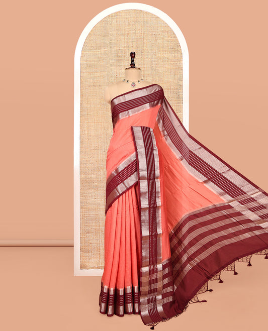 Peach Plain Assam Silk Saree, Complemented by a Contrast Traditional Zari Border, Zari-Striped Pallu, and a Contrast Blouse