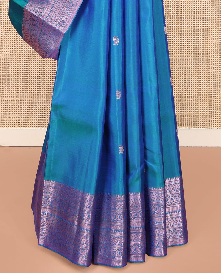 Blue Kanchipuram Silk Saree, Graced with Mayil and Chakram Thread Buttas on Its Body, Highlighted by a Self-Border of Rekku, Neli, Kathir, and Kodi Visiry Designs, Pallu of Jaal Designs, and Paired with a Matching Blouse