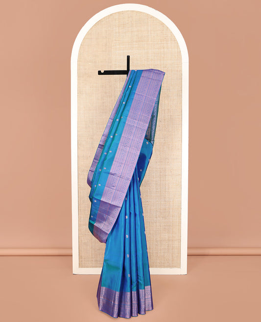 Blue Kanchipuram Silk Saree, Graced with Mayil and Chakram Thread Buttas on Its Body, Highlighted by a Self-Border of Rekku, Neli, Kathir, and Kodi Visiry Designs, Pallu of Jaal Designs, and Paired with a Matching Blouse