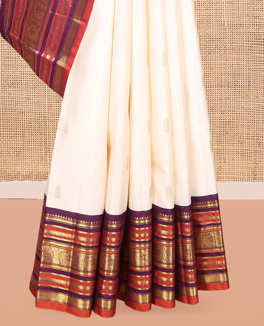 White Kanchipuram Silk Saree, Enthralled with Zari Buttas, a Contrast Korvai Border of Rekku, Muthu, Banaras, Poun, Mayil, Kathir, and Mayil Kann, Grand Pallu, and a Contrast Blouse