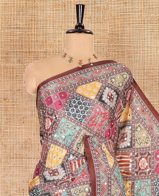 Brown colorful patterns printed and mirror work masakali saree, printed border, printed pallu, and a matching blouse