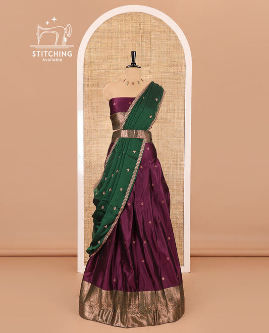 Purple taffeta silk half-saree, zari buttas with contrast traditional zari bordered skirt, matching zari design blouse, and contrast scallop buttas embroidered dhavani